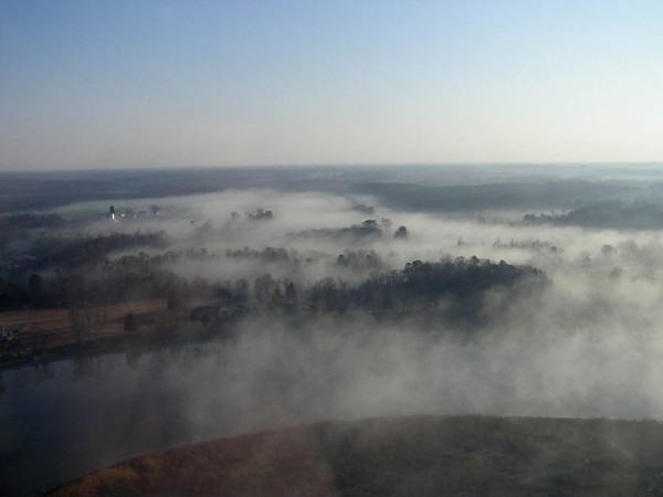 A fog lifts from a farm along the Mattaponi River