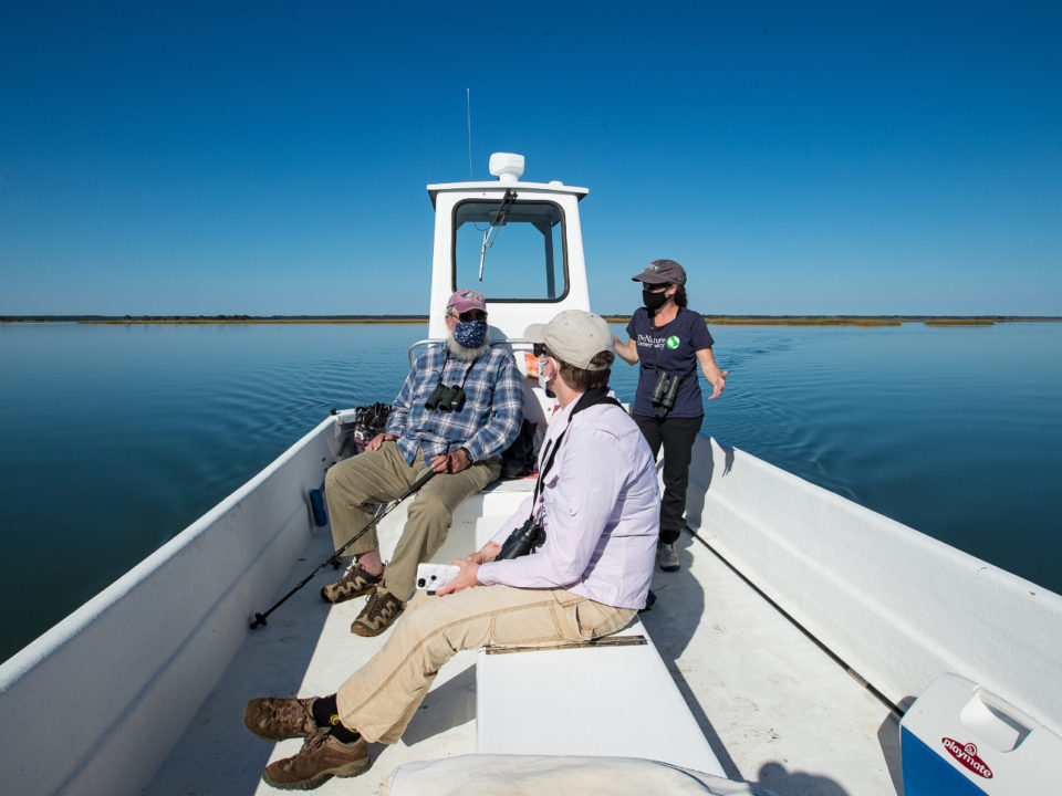 Barry Truitt, Laura Chamberlin and Alex Wilke talk shorebirds on a trip out to Smith Island