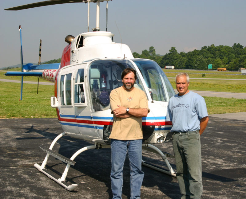 Bryan Watts and Shawn Padgett with the bell ranger used to survey 242 natural cliffs