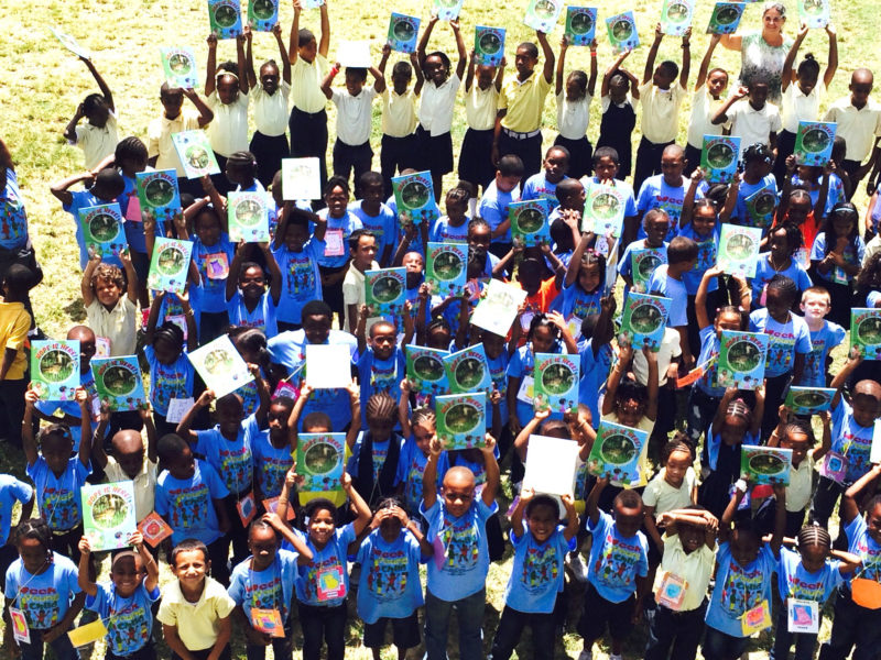 Children from Cruz Bay hold up their copy of “Hope is Here.”  Photo courtesy of Cristina Kessler.