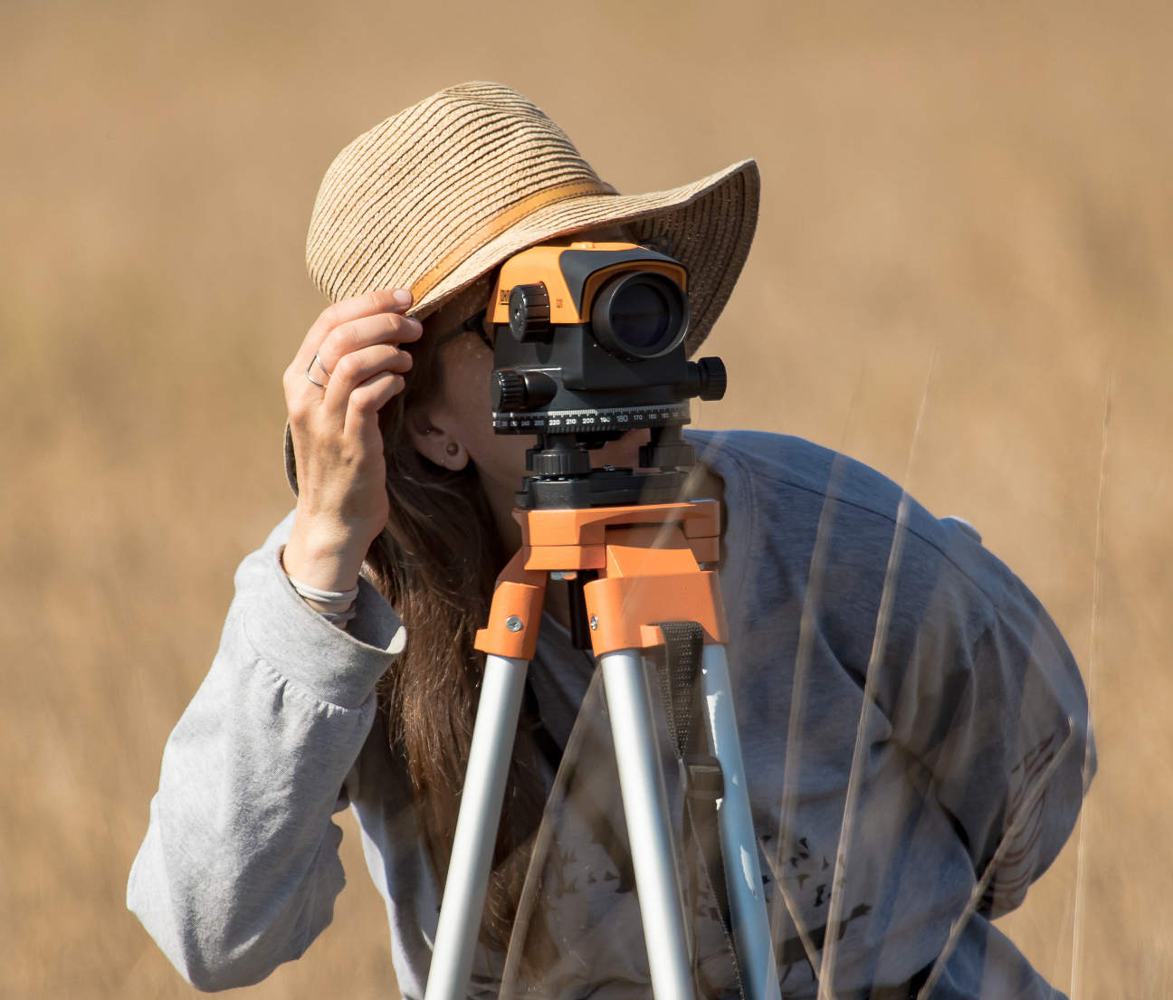 Laura Duval uses an optical level to shoot elevations within a FL