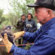 Mitchell Byrd holds a captive-reared peregrine falcon in the early 1990s